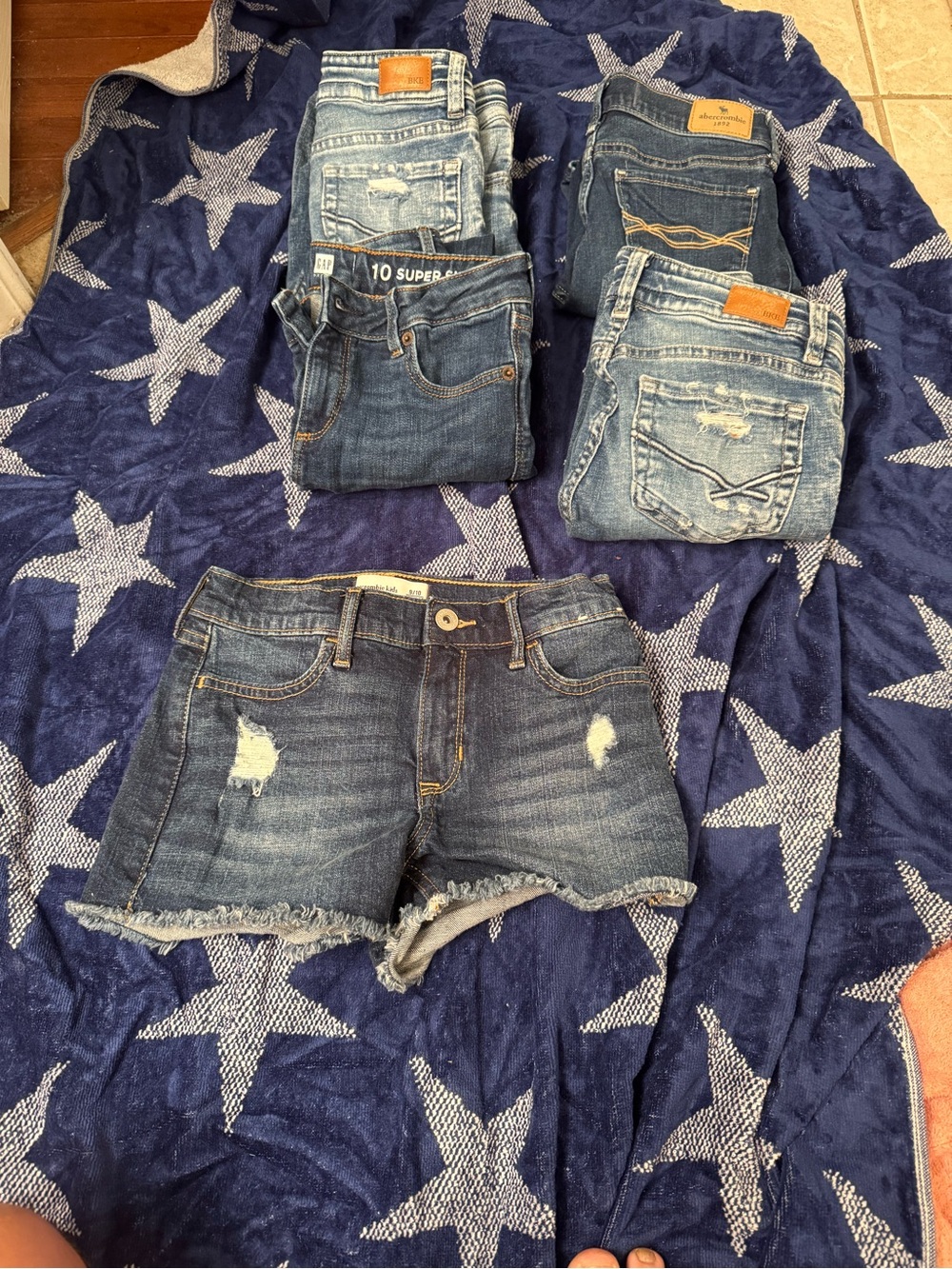 BKE,GAP, and ABERCROMBIE BLUE JEANS AND SHORTS. 4 pair of jeans and 1 pair short